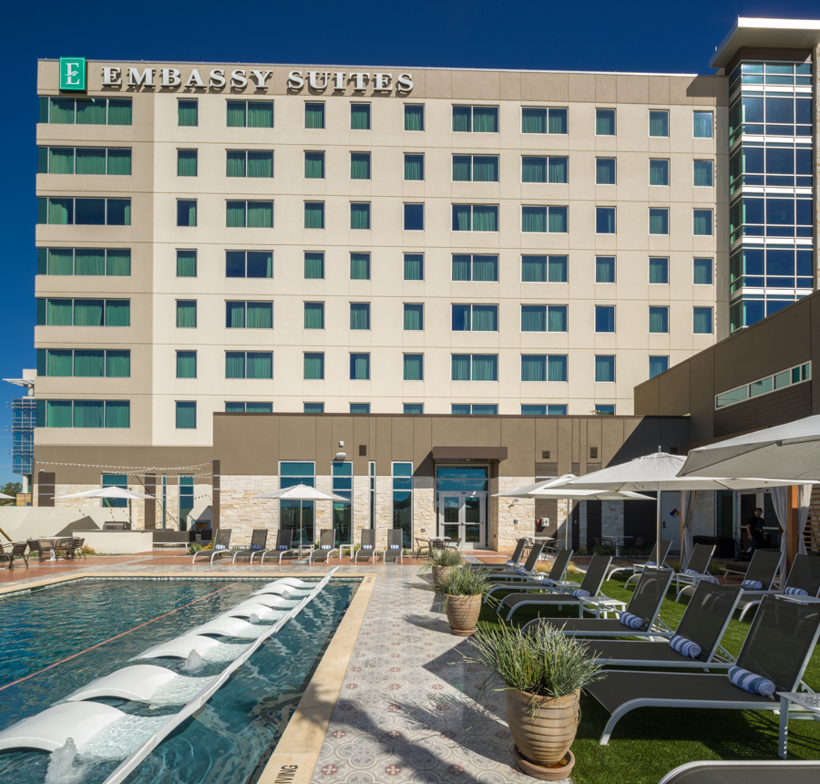 Embassy Suites hotel exterior and pool in San Antonio, USA