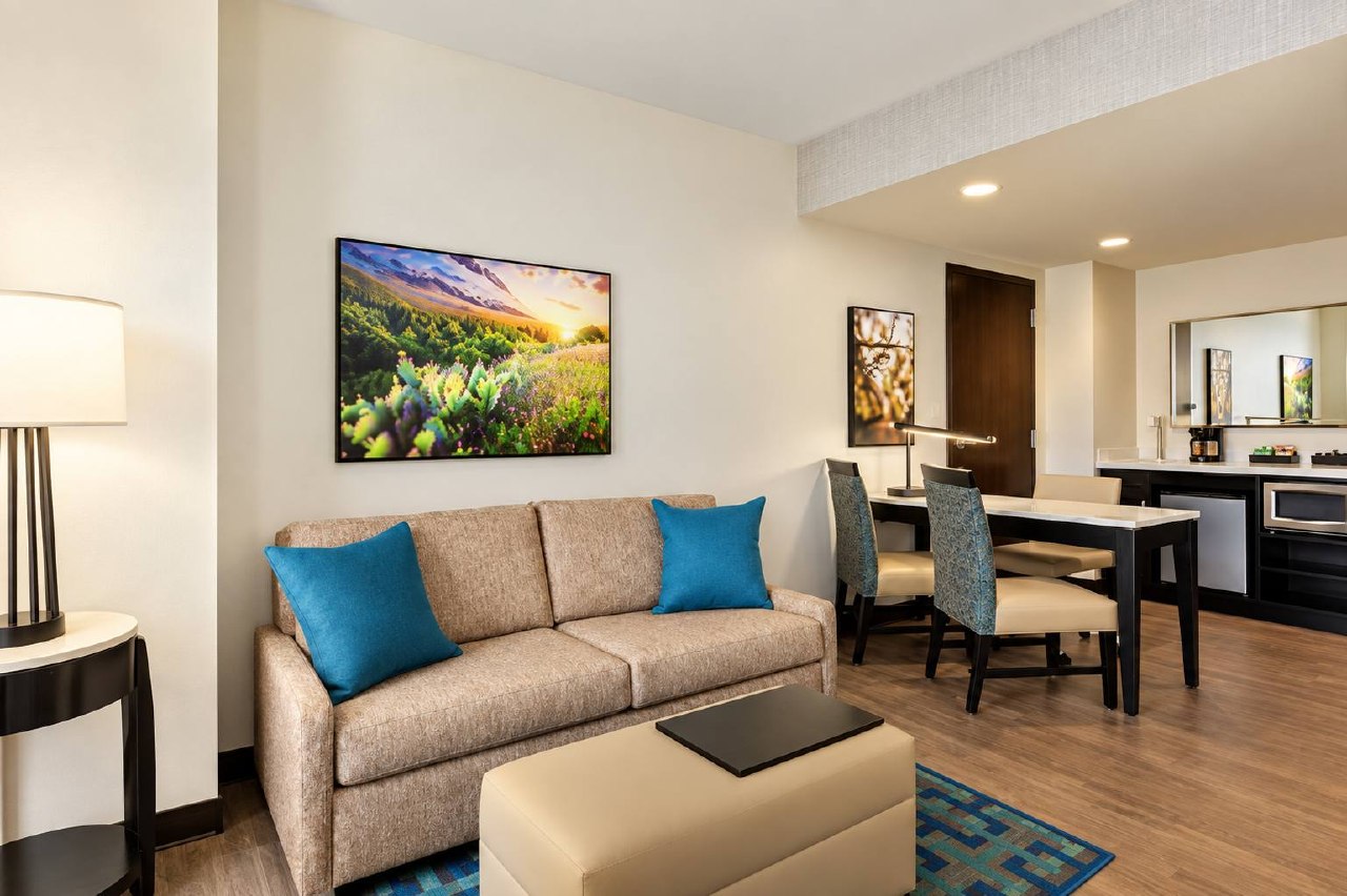 Suite lounge and dining area with sofa and kitchenette
