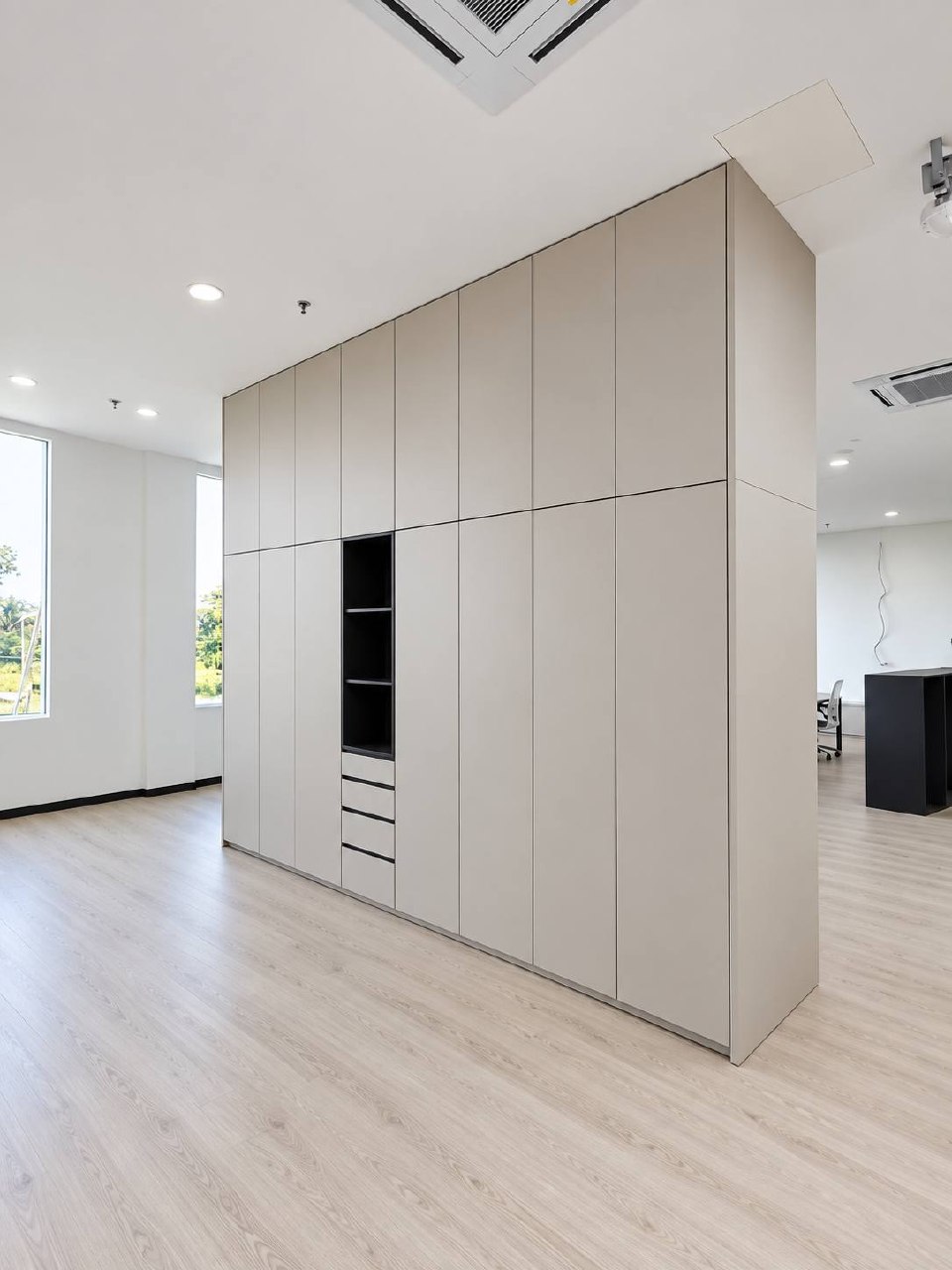 Francestel Factory full-height pale cabinetry with integrated shelving