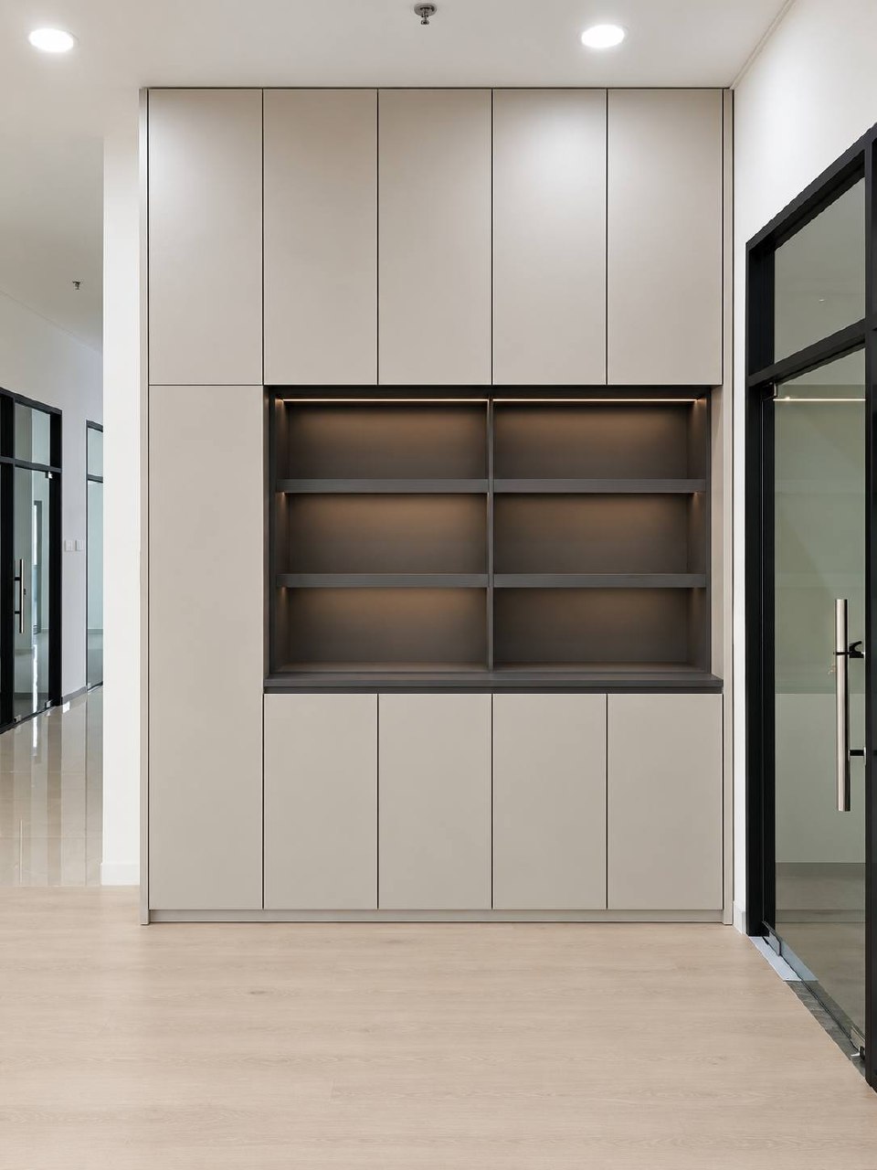 Francestel Factory display shelving set into pale custom cabinetry