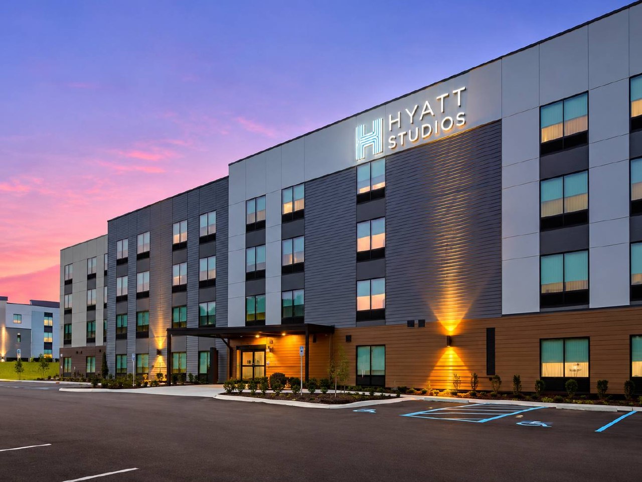 Hyatt Studios hotel exterior at dusk in Huntsville, USA