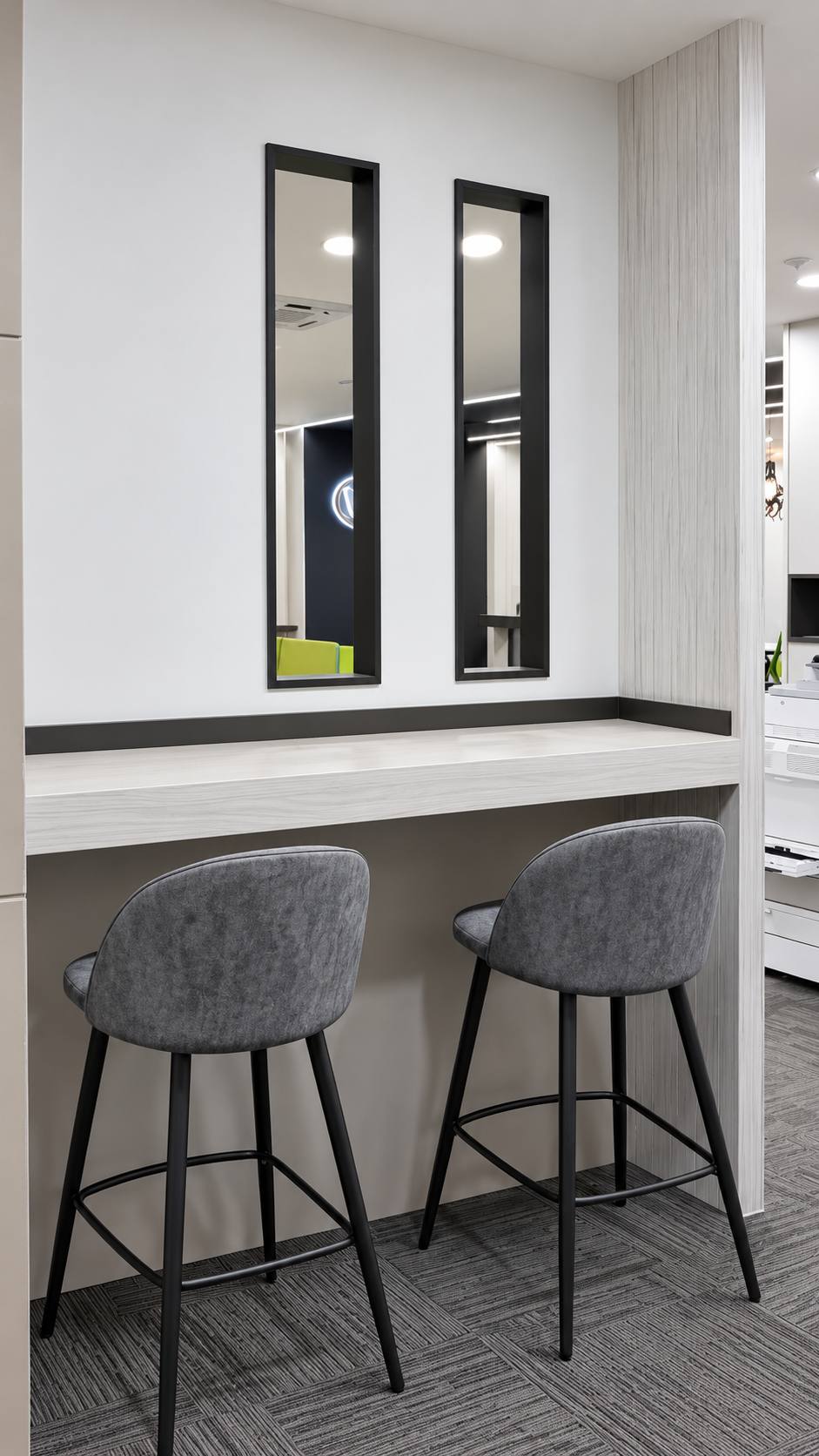 Jeff Office breakout seating beside a built-in counter